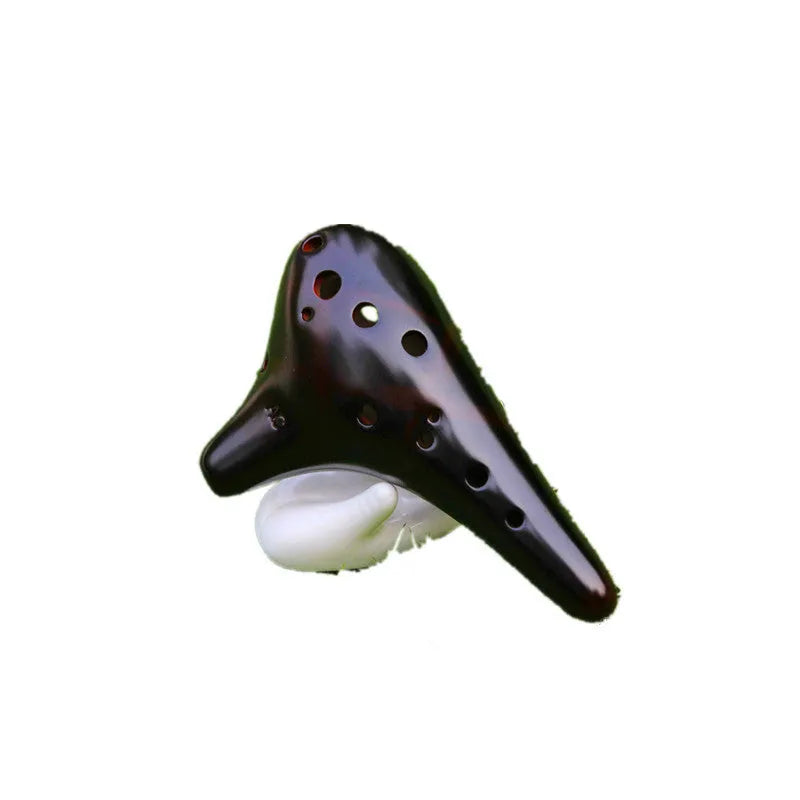 Smoked brown 12-hole dolomite ocarina, 14x8cm, midrange C, with raw lacquer surface.