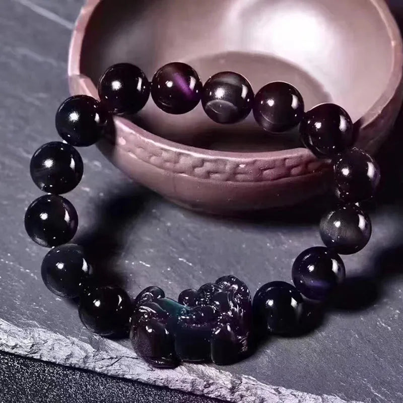 Natural ice colour obsidian crystal bracelet showing different bead size options on a wrist.