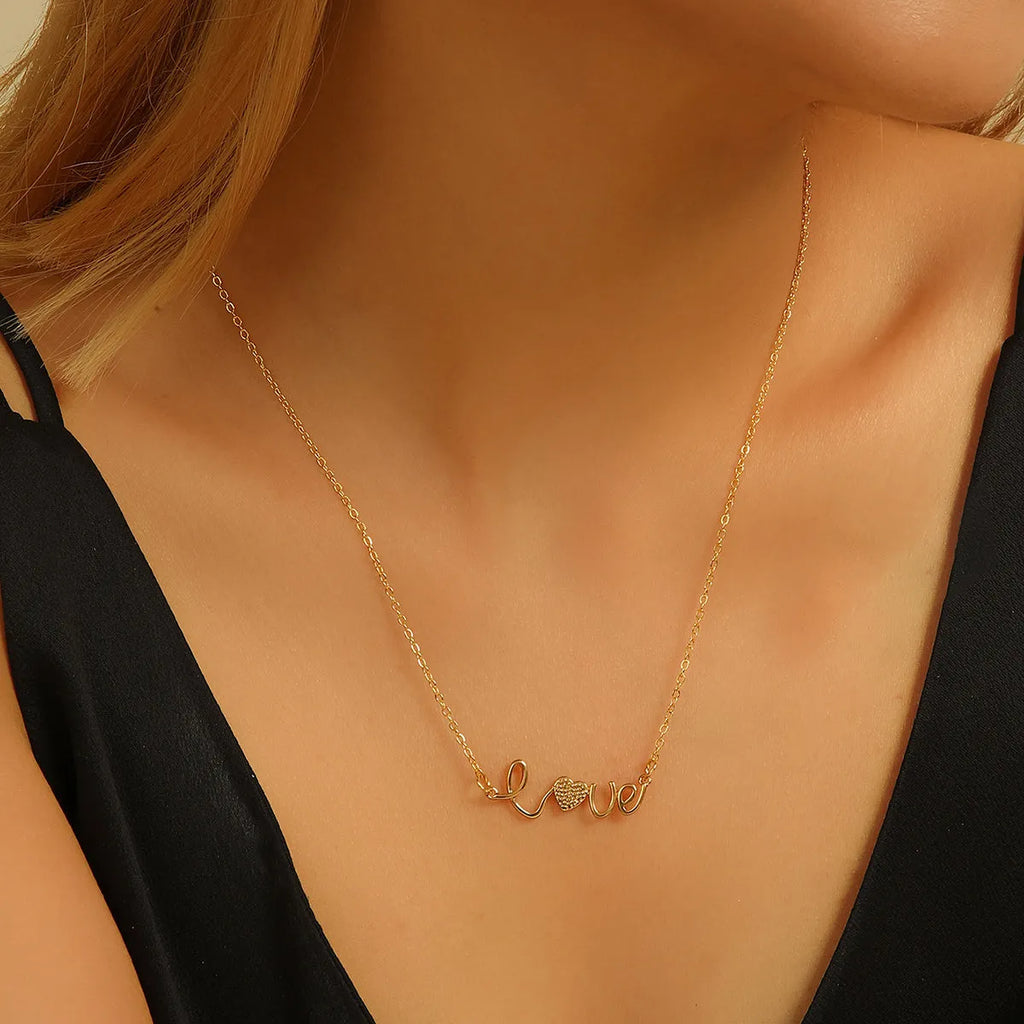 Gold plated copper infinity love pendant necklace with diamond accents and fine chain.