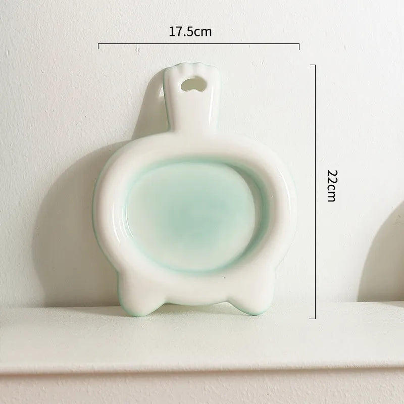 Ceramic cat bowl in a choice of colours with a shallow plate design for pet food.