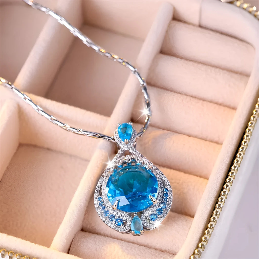 Blue geometric pendant necklace with fireworks cut crystal gemstone and water wave chain