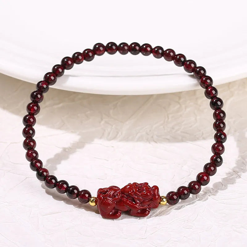 Natural garnet square bracelet with a carved purple sand and strawberry quartz Pixiu charm.