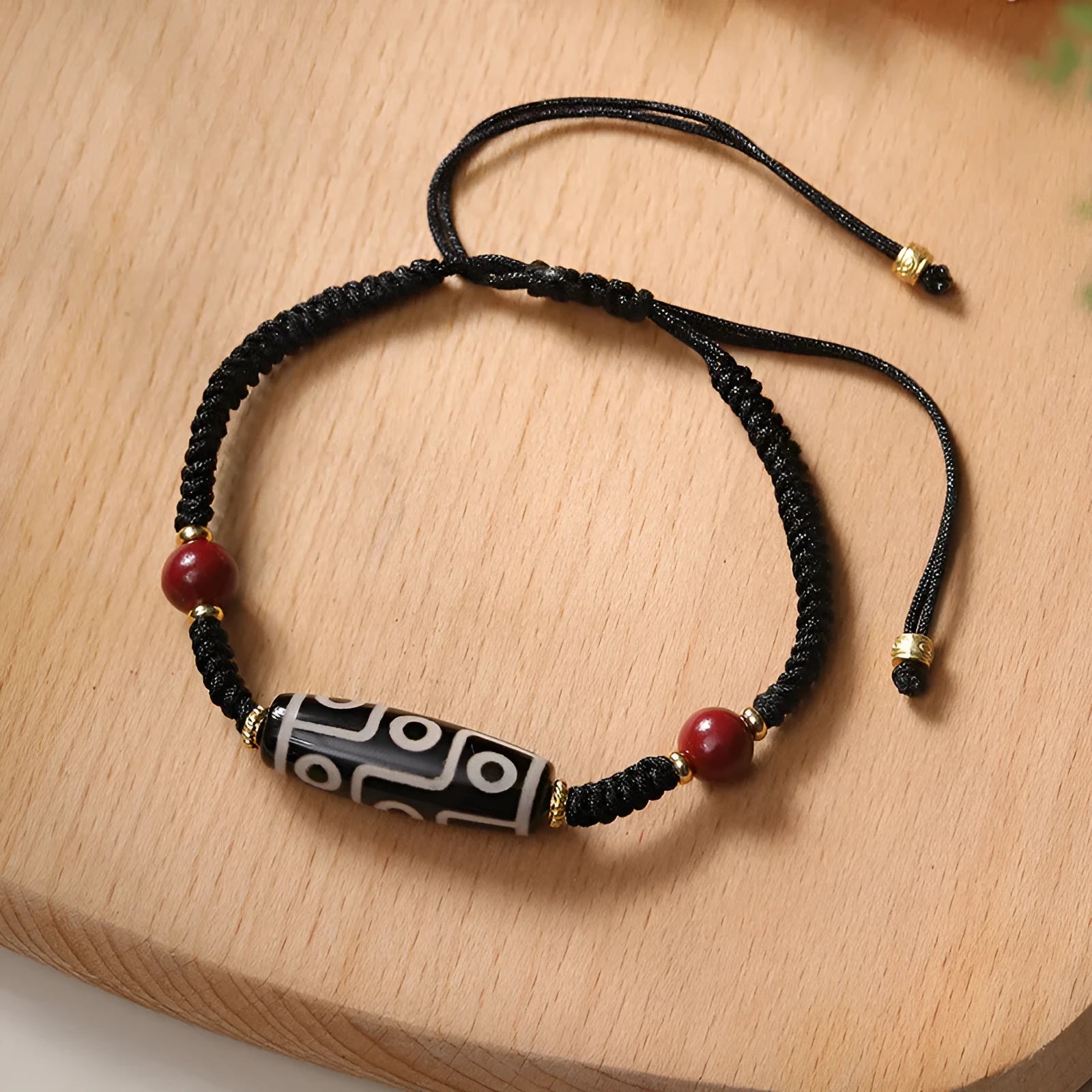Men's shrinkable agate bracelet with Tibetan Dzi bead patterns on a wrist