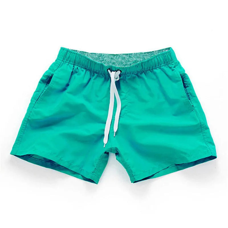 Men's straight leg beach shorts in polyester fabric available in multiple colours and sizes