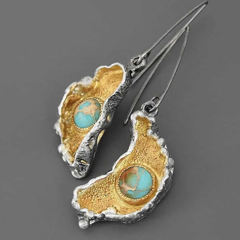 Ear-shaped women's earrings in alloy with a two-tone oil-painted geometric finish, shown as a pair