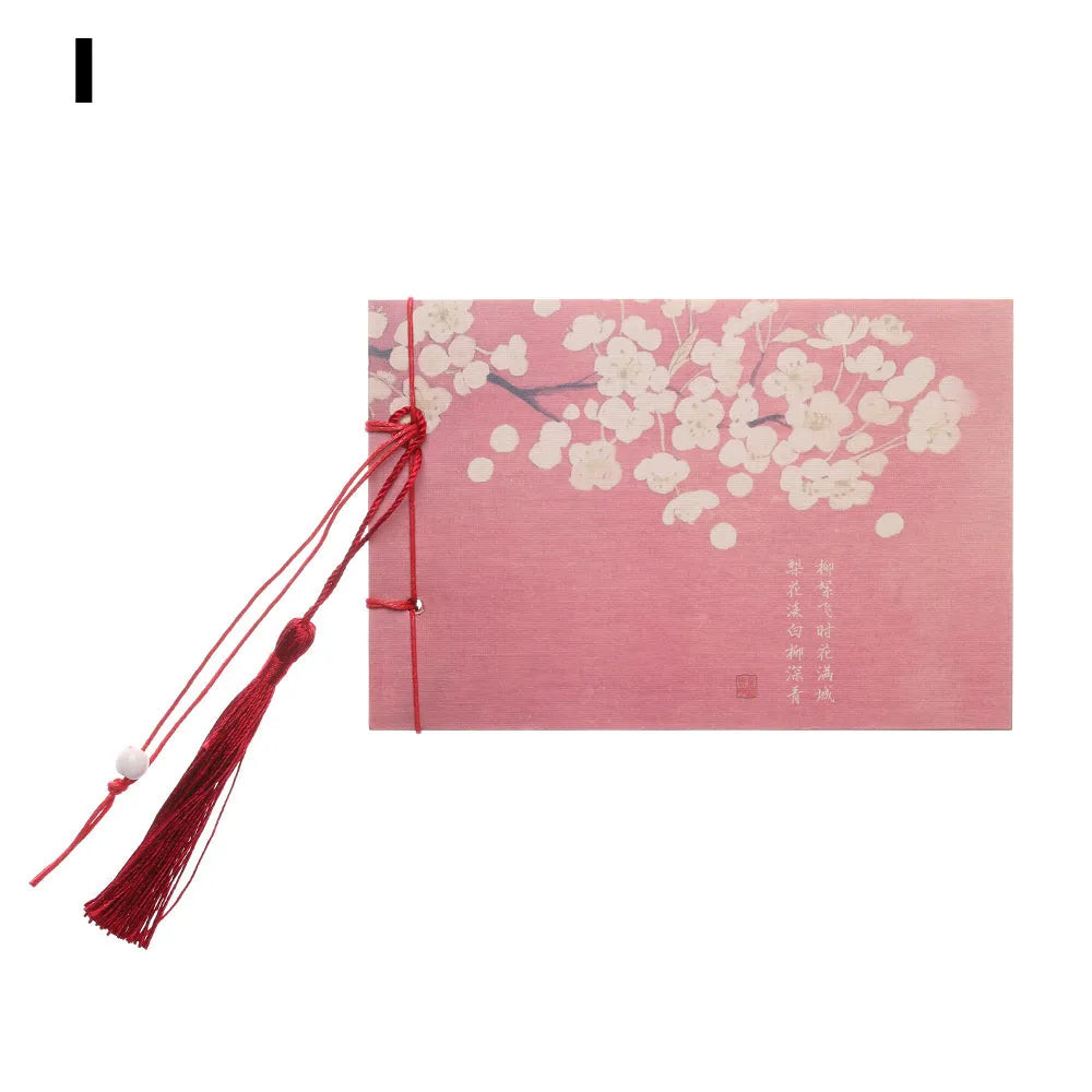Hand-stitched kraft paper notebook with a tassel bookmark, shown in a natural colour.