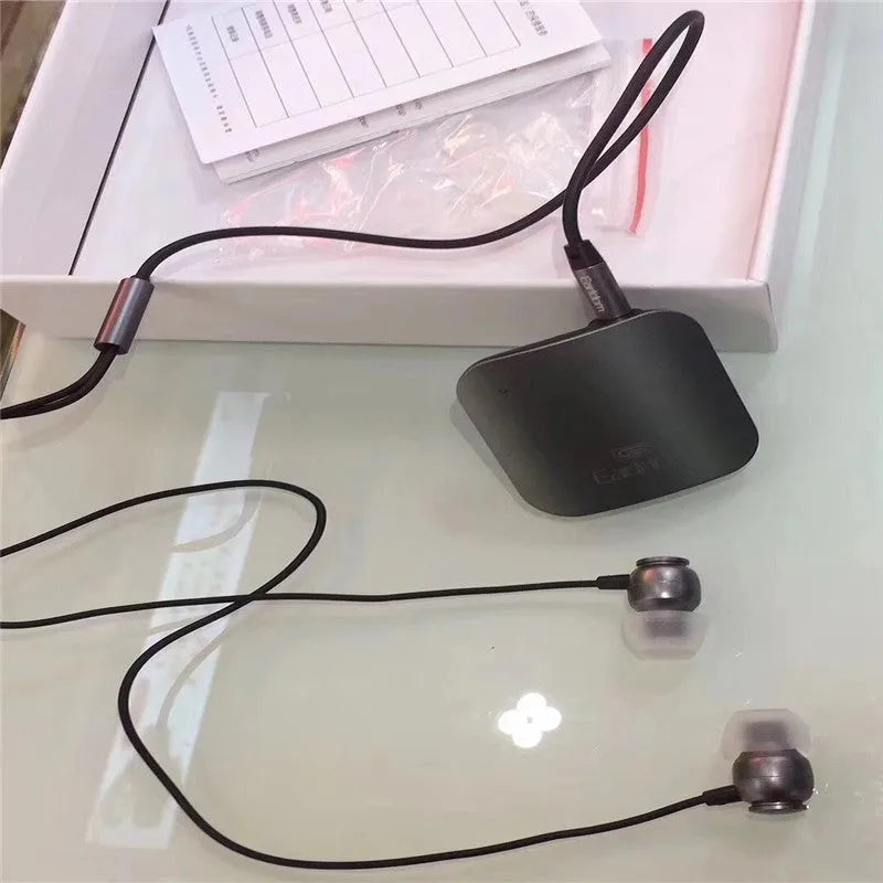 Bluetooth lavalier headset in black, grey, or red colours with 10-metre wireless range for hands-free communication
