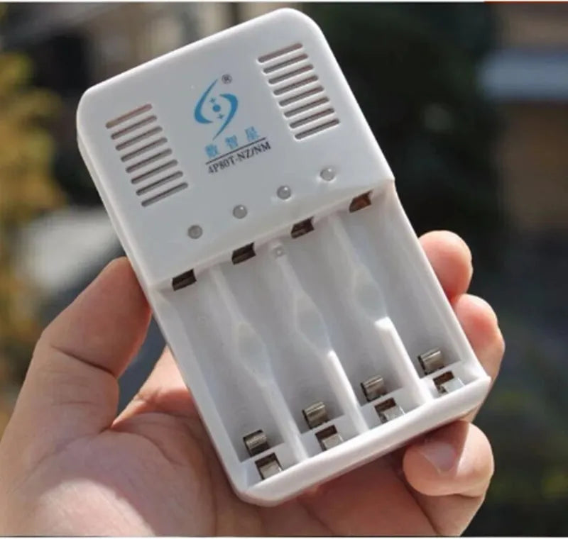 White rechargeable battery charger for 1.6V nickel-zinc batteries with four batteries and US plug