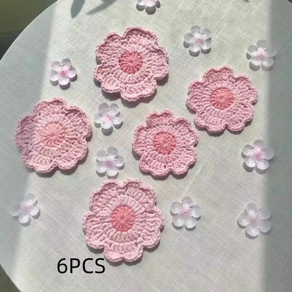 Hand-woven wool coaster in natural colour protecting wooden table from drink