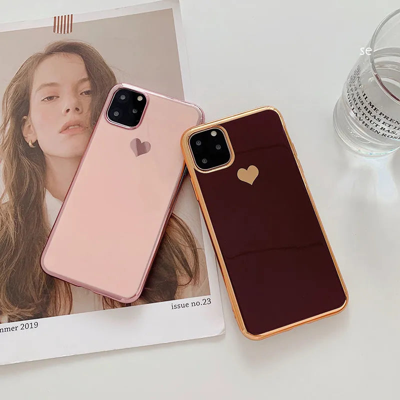 Simple solid-colour TPU back cover case for iPhone on a table, showing blue colour option.