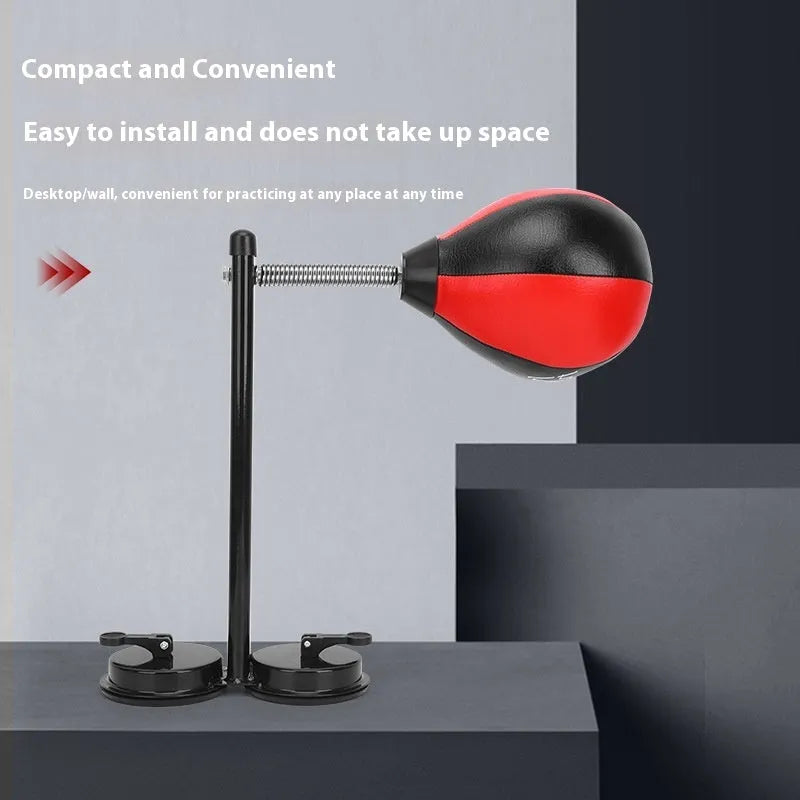 Pear-shaped inflatable punching ball with red and black design mounted with suction cups for boxing training