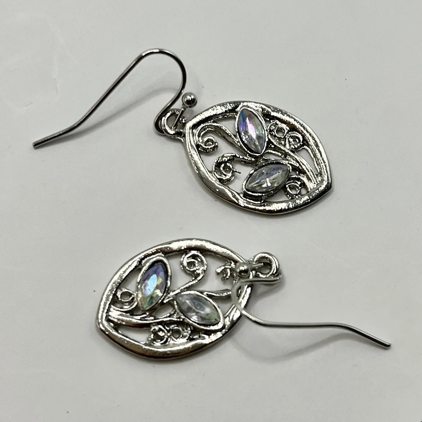 Silver alloy leaf earrings with embedded colourful moonstone, diamond cut treatment details