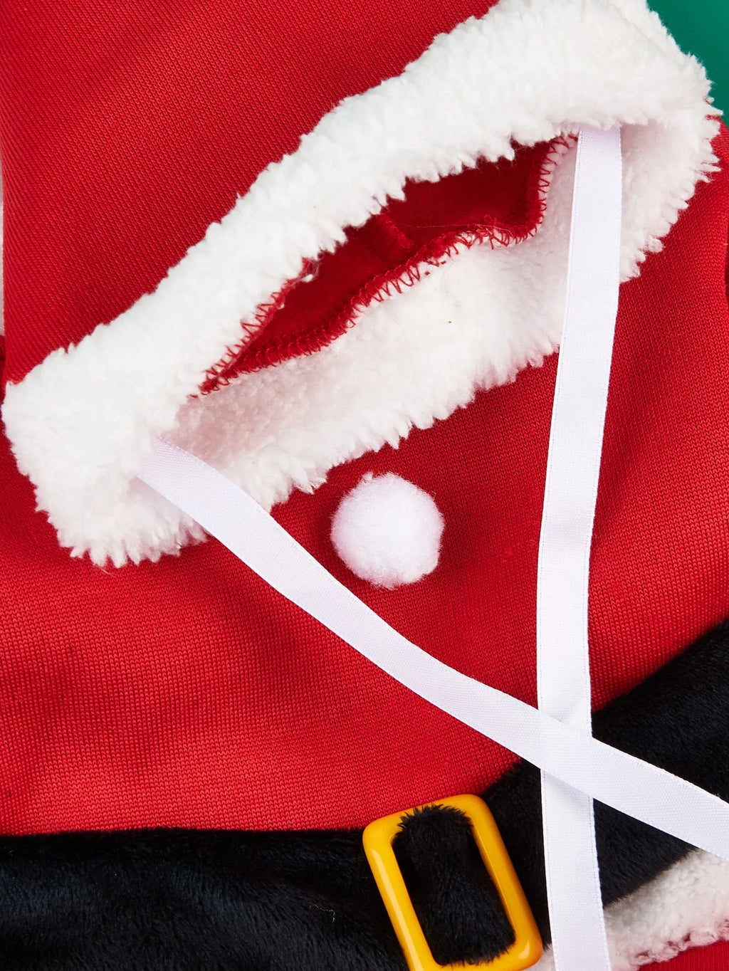 Red polyester Christmas pet costume on a small dog with matching cap