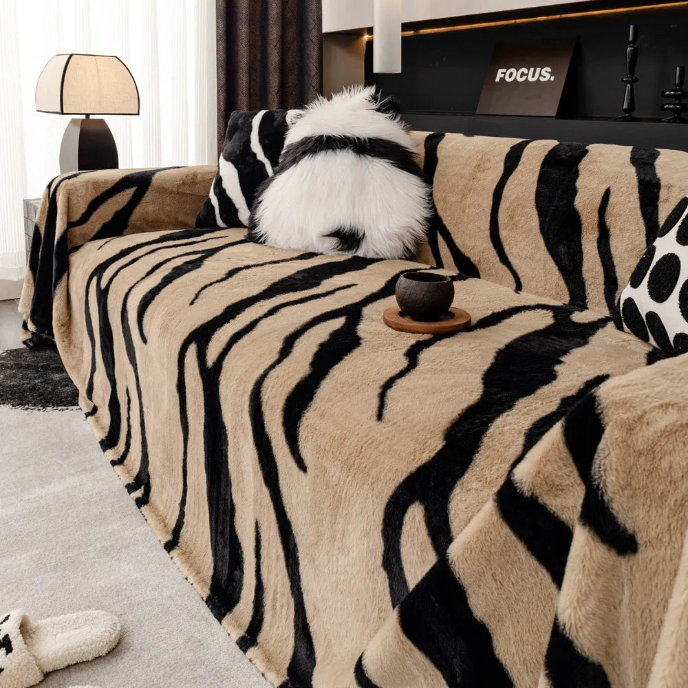 Zebra pattern flannel sofa cover with matching pillowcase on a sofa.