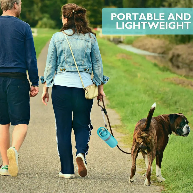 Blue plastic portable dog pooper scooper with built-in bag dispenser and carrying lanyard.