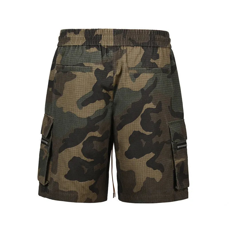 Men's green camouflage cotton work shorts with multiple pockets and a loose fit.