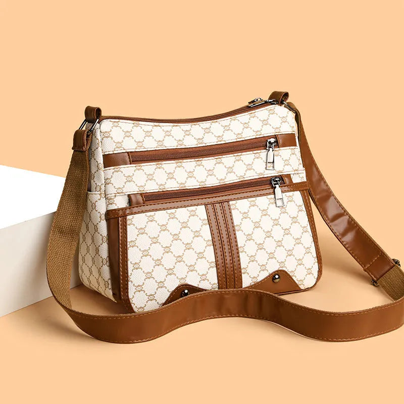 Women's brown and white stitching pattern large-capacity crossbody bag made from PU leather.