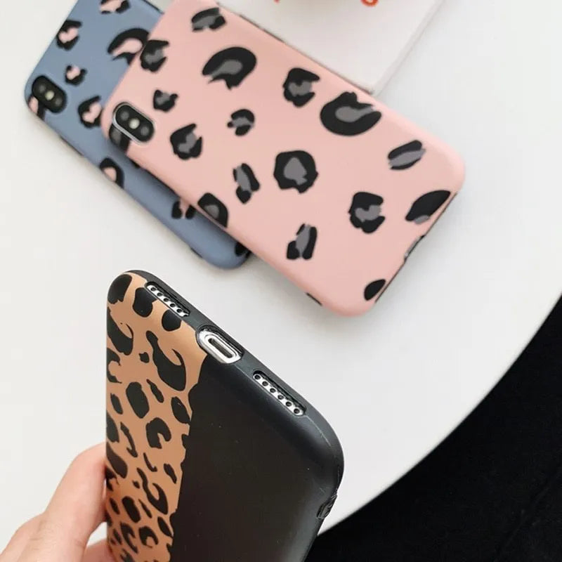 Leopard print pattern phone case for iPhone, shown in black, blue, and pink colour options.