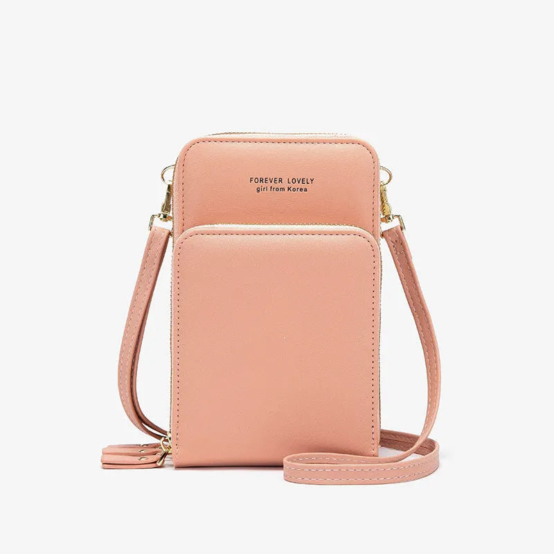 Green crossbody bag with tri-fold pockets and zipper closure on white background