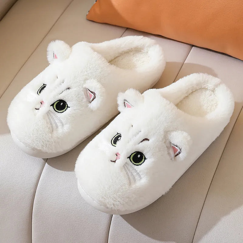 Cute cat plush slippers with non-slip EVA sole, thickened design, available in pink colour on a floor surface