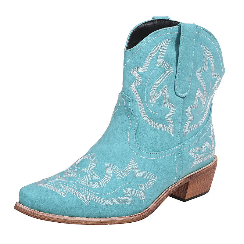 Women's blue embroidered cowboy boots with low wedge heel and pointed toe.