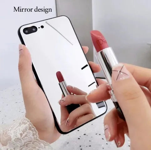 Black mirror phone case for Apple iPhone models X, 7 Plus, and 8 Plus on a table.
