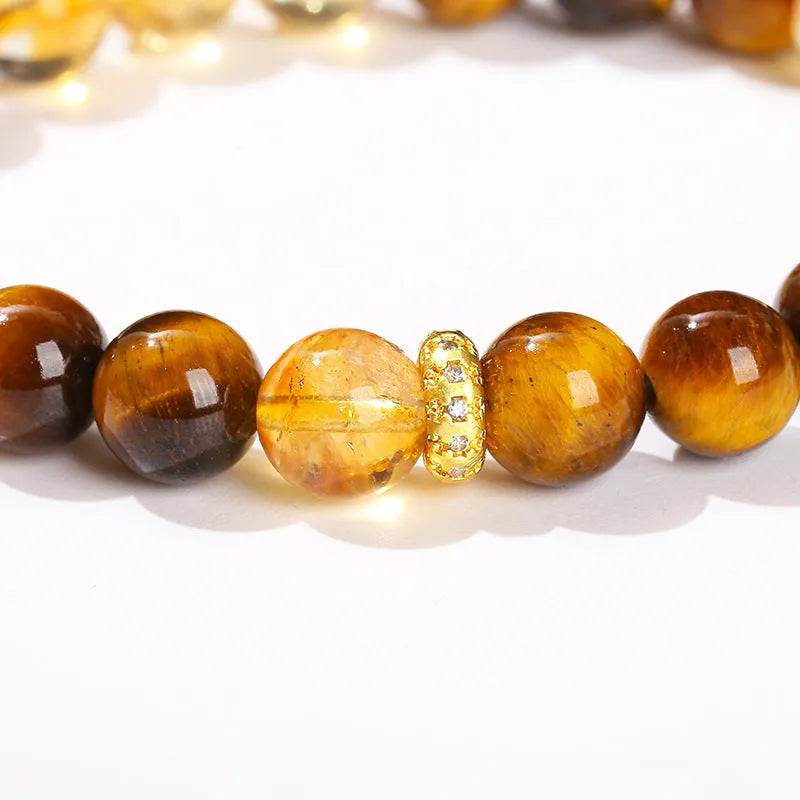 Natural yellow tiger's eye crystal bracelet with mixed yellow tower charms on wrist
