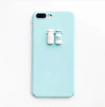 Soft silicone iPhone case with a raised 3D cartoon cat design on the back, shown in pink.