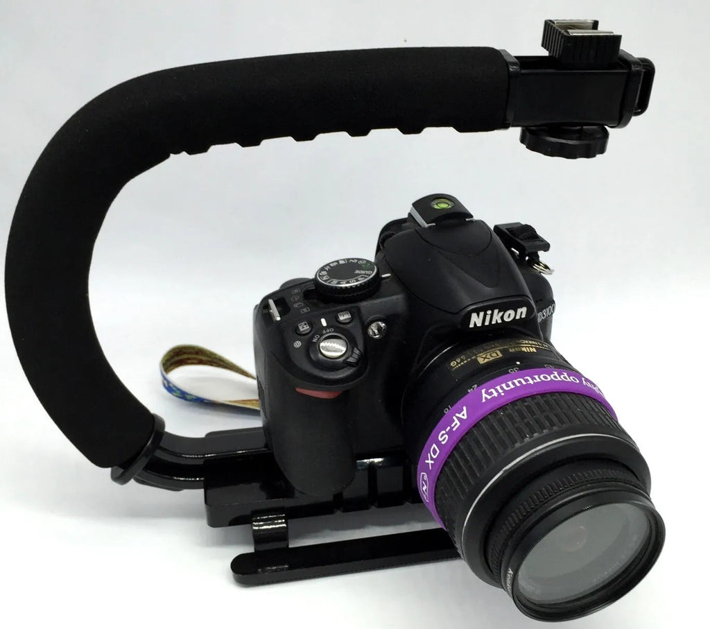 Handheld camera stabiliser bracket with plastic handle and sponge grip for SLR cameras