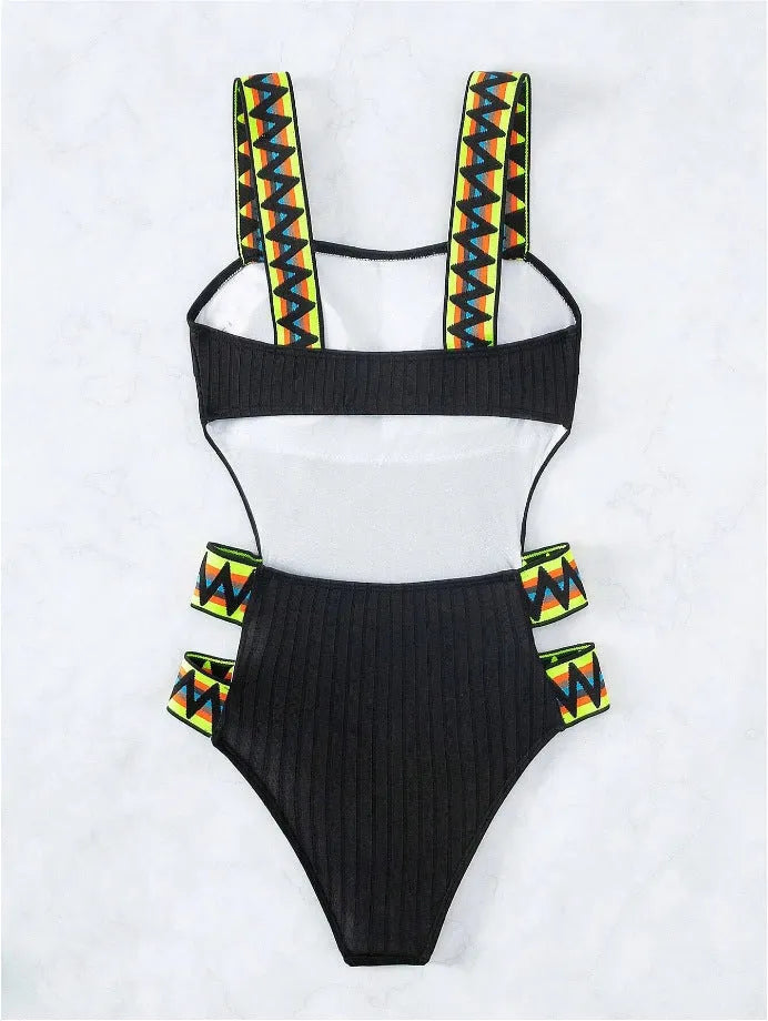 Women's solid colour one-piece swimsuit in black, made from quick-dry polyester fabric.