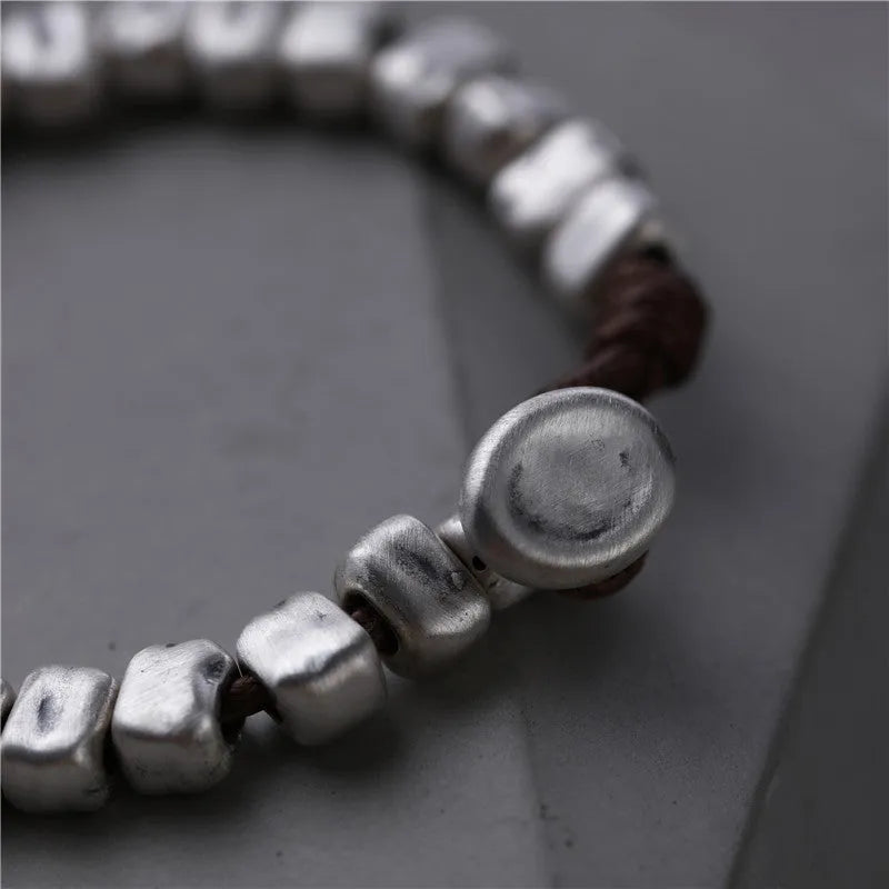 Women's handmade silver bracelet with irregular square design and elastic band
