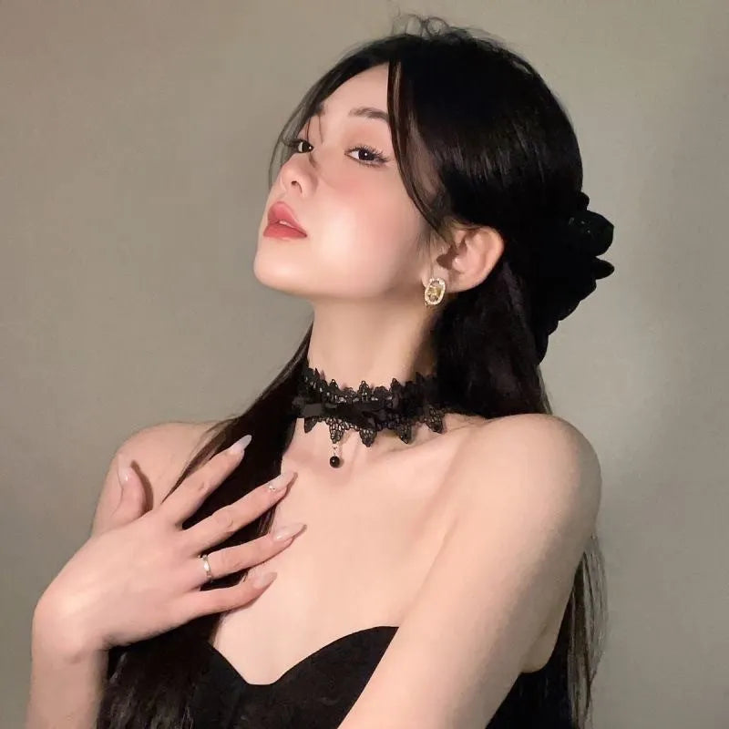 Lolita gothic bow lace choker necklace with fabric pendant and alloy chain on display