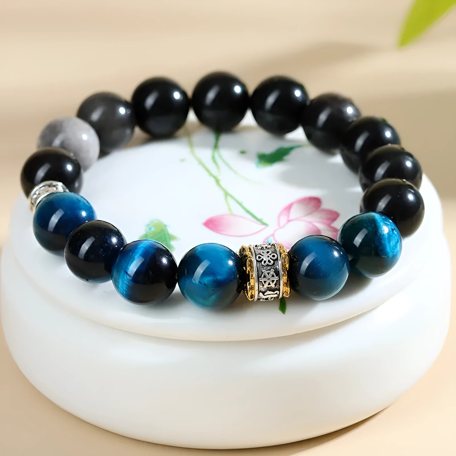 Peacock blue Tigereye stone bracelet with geometric ethnic design on wrist