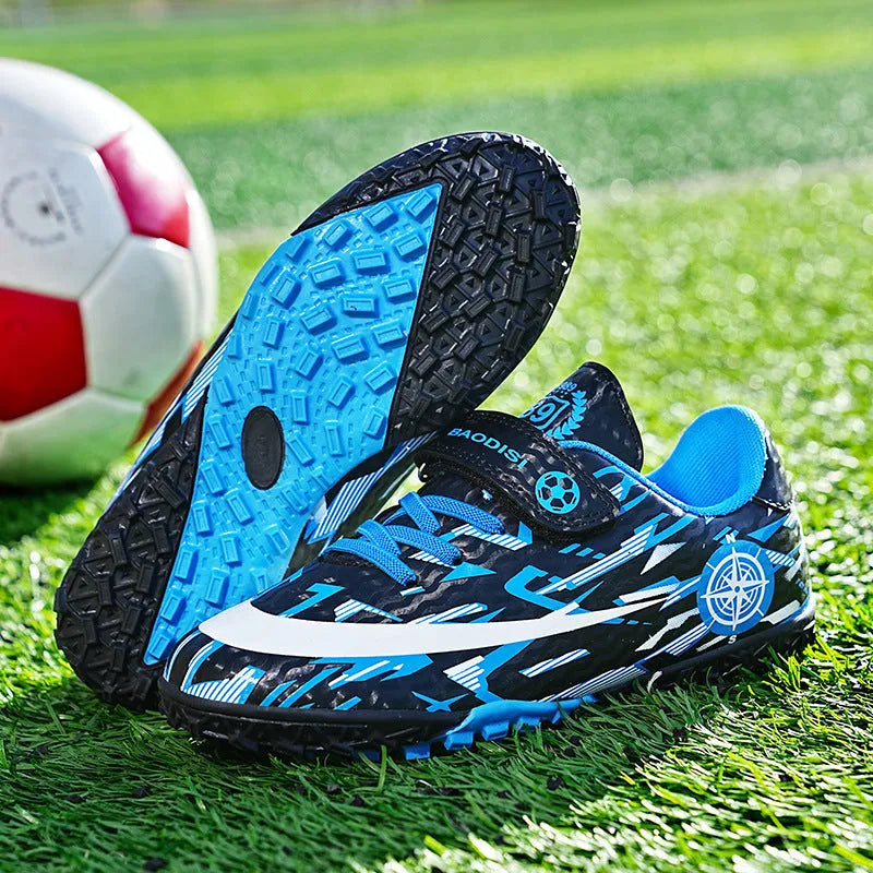 Children's football shoes with Velcro fastening, non-slip rubber outsole, and spikes in sky blue colour, low-top design