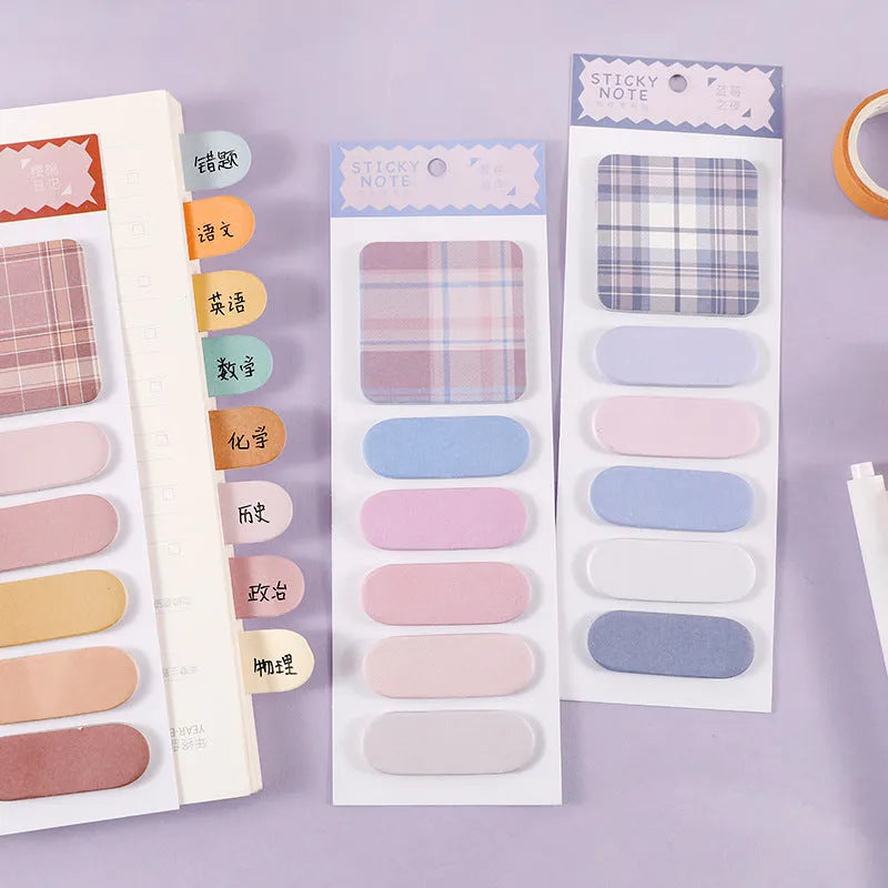Colourful memo pad sticky notes showing eight different colour themes including plaid and solid designs.