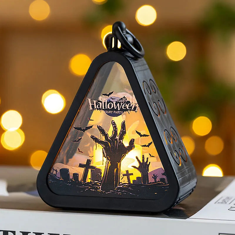 A portable Halloween pumpkin lamp decoration in one of four colour themes: pumpkin, witch, castle, or ghost hand.