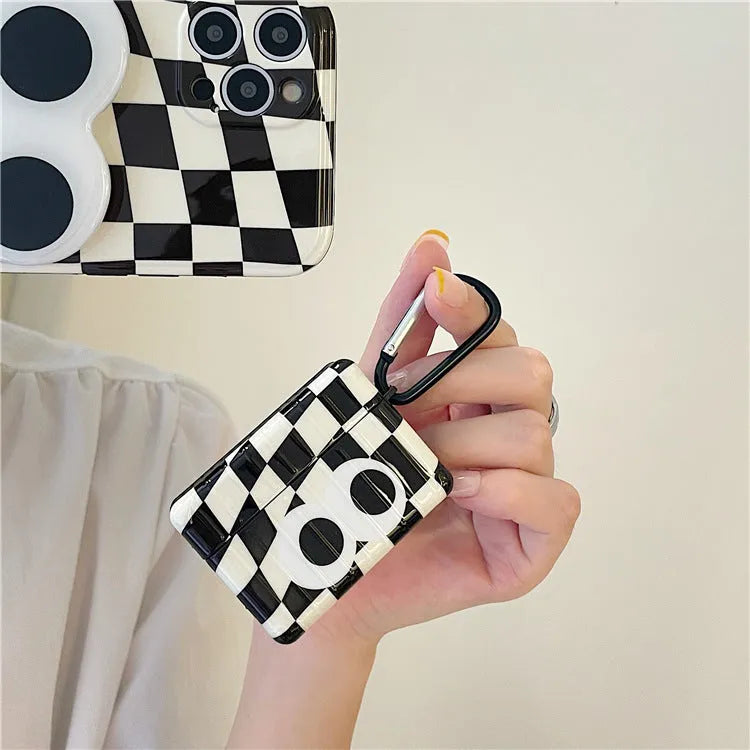 Black and white checkerboard pattern AirPods protective cover with large eye design for Apple AirPods models