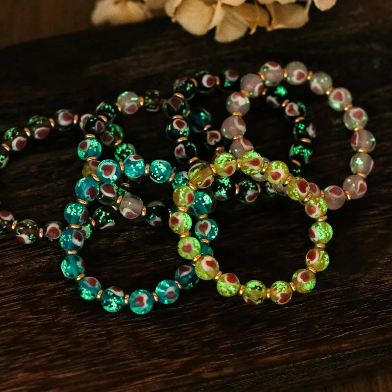 Handmade glass bracelet with swallowing gold beast design and heart shape in various colours