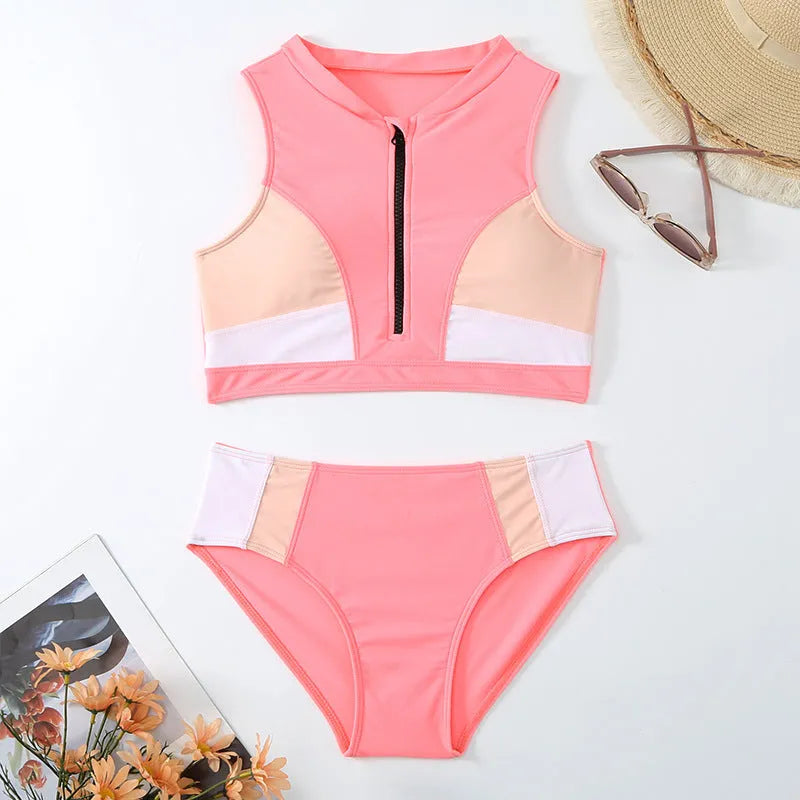 Pink high-waist bikini swimsuit with brief style shorts and a sleeveless top.