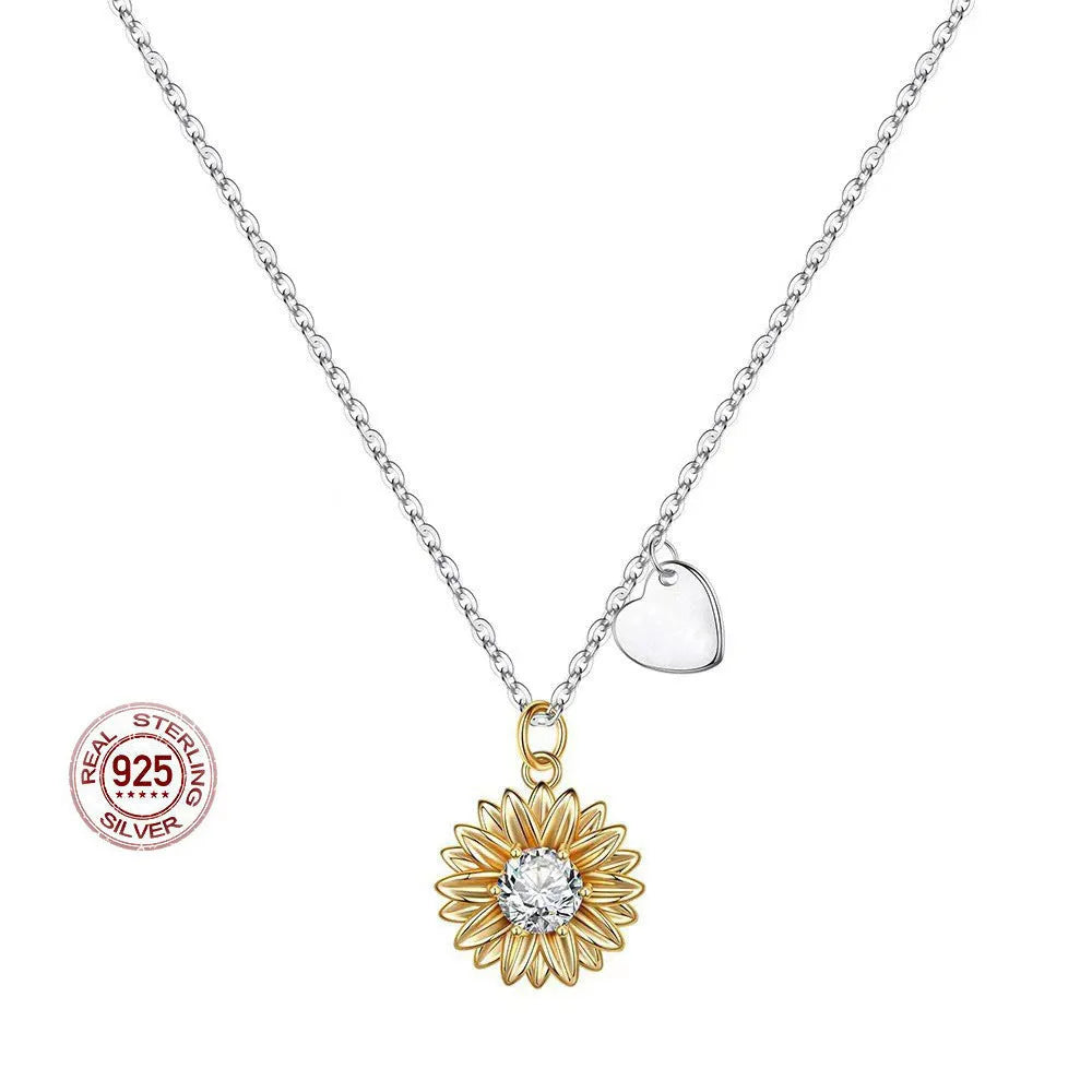 Women's adjustable sterling silver sunflower necklace with daisy petal design on a cross chain.