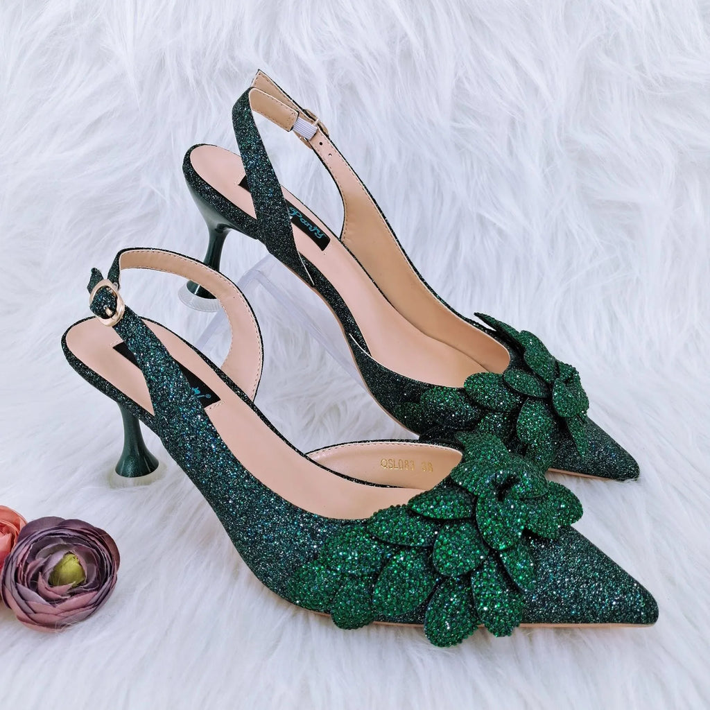 Party shoes and bag set with wine glass heel, rhinestone decoration, and buckle fastening in silver colour