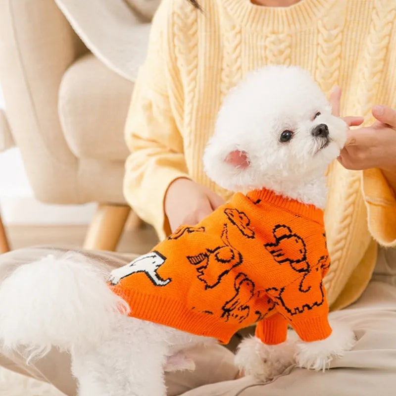 Small dog wearing a blue winter knitted sweater with charming patterns, soft polyacrylic material, side view