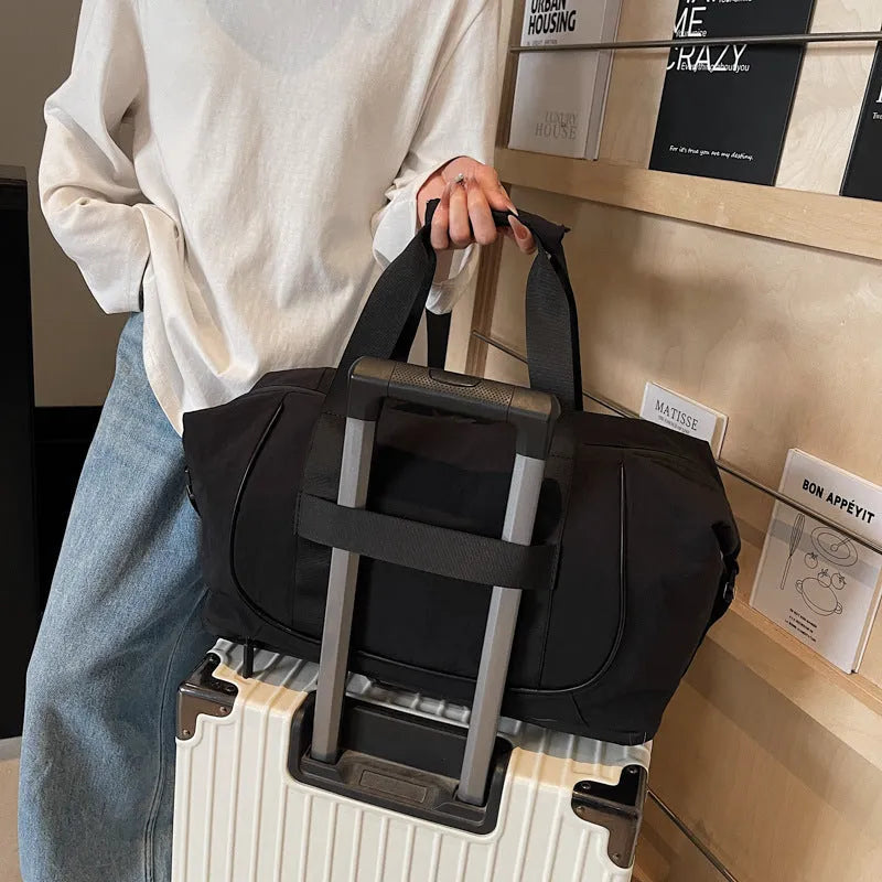 A milky white Oxford cloth crossbody bag for yoga and fitness, shown in a one-shoulder carry style.