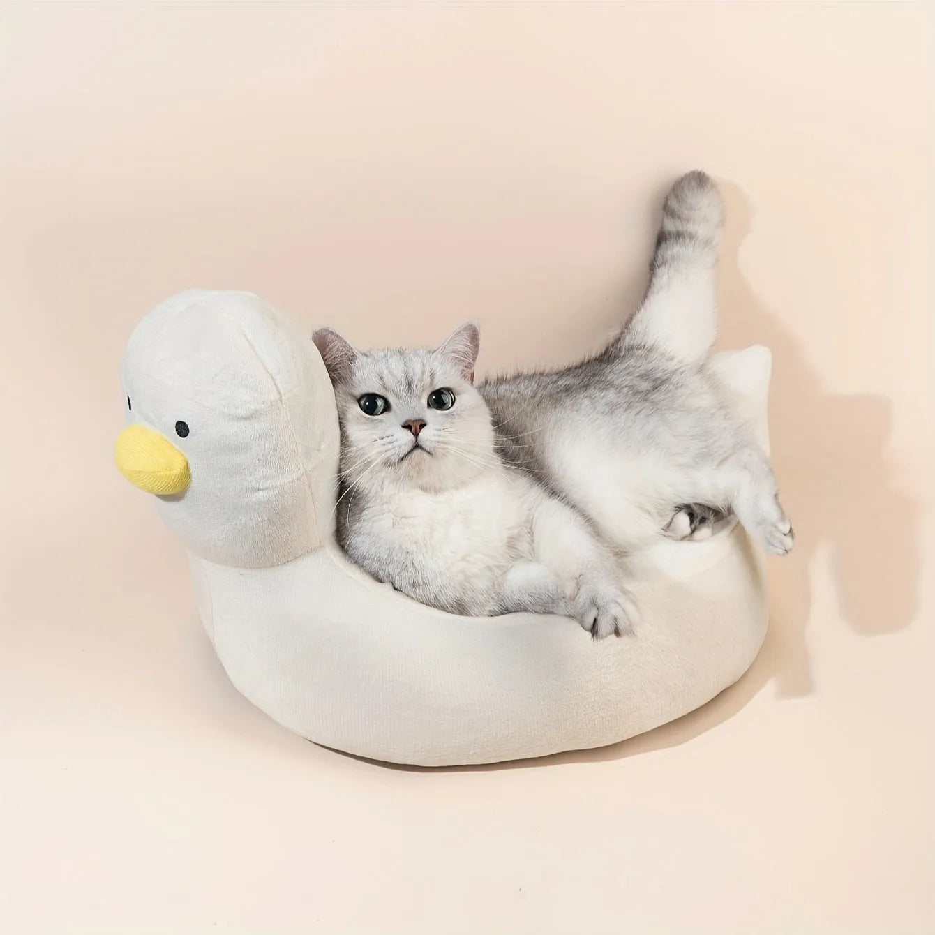 Blue duck-shaped fluffy pet bed for small dogs and cats on floor