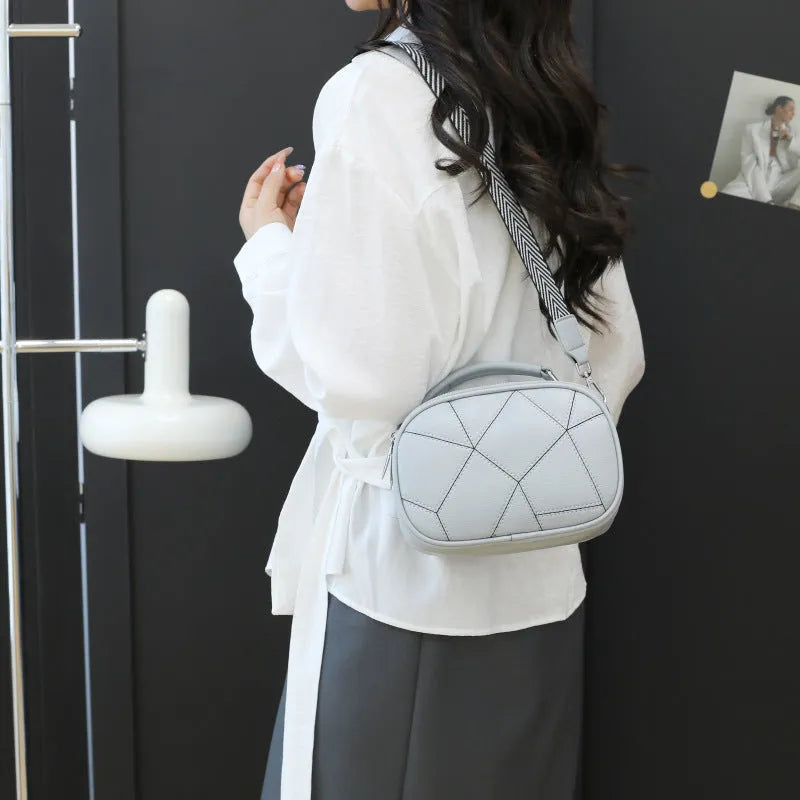 Three-layer retro patchwork small bag in round suitcase shape with stitching detail