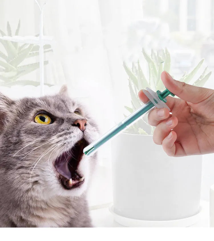 Two pet pill shooters with soft silicone tips for administering tablets to cats and dogs