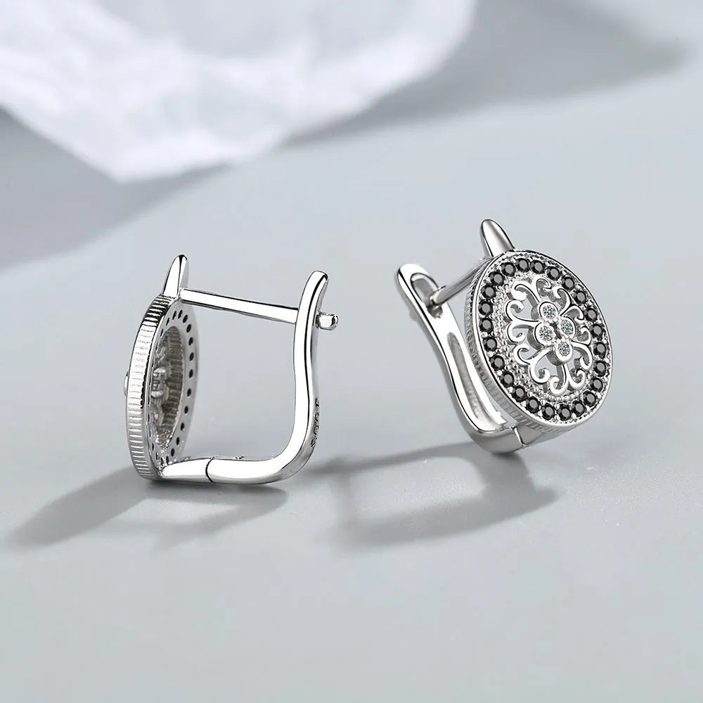 Pair of round diamond-encrusted ear clip earrings in copper white gold plated platinum colour