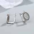 Pair of round diamond-encrusted ear clip earrings in copper white gold plated platinum colour
