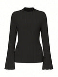 Black long sleeve slim fit top with round neck and lantern sleeves.