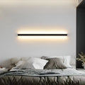 80cm black aluminium LED strip wall lamp with touch control panel on a modern interior wall.
